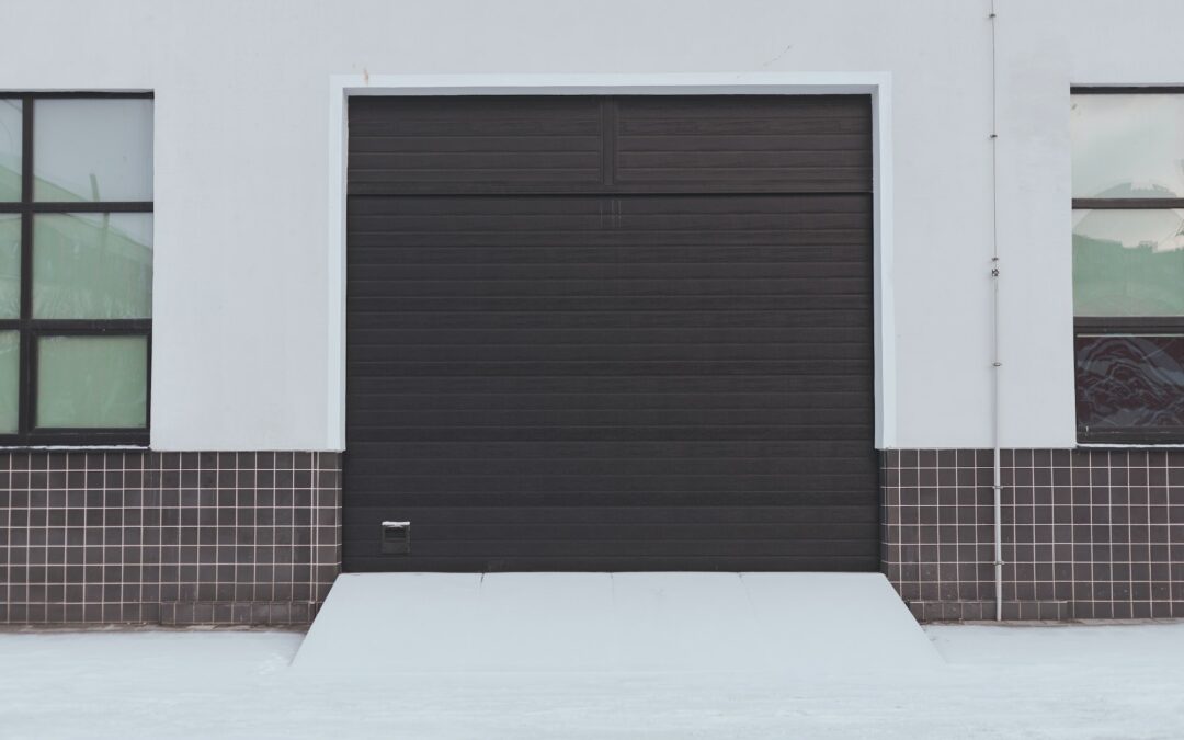 Automatic metal roller door in storage and industrial warehouse.