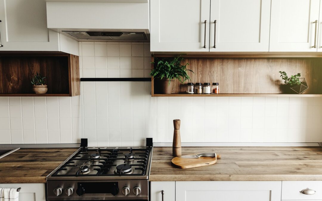 Kitchen interior with furniture and stainless steel appliances in a new house