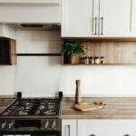 Kitchen interior with furniture and stainless steel appliances in a new house